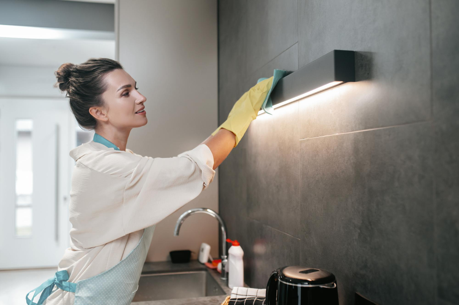Cleaning professional working on the bathroom